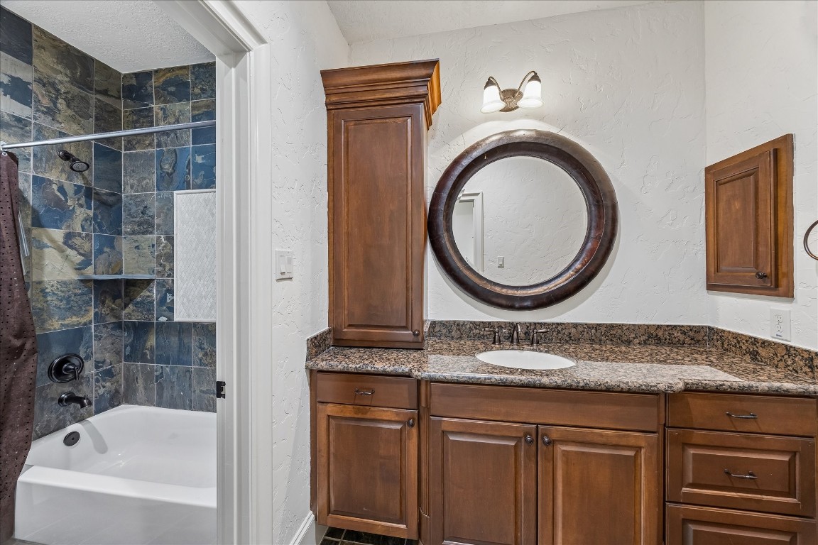 5402 White Birch Run Spring, TX 77386 - Photo 33 of 43 a bathroom with a granite countertop sink a mirror and bathtub
