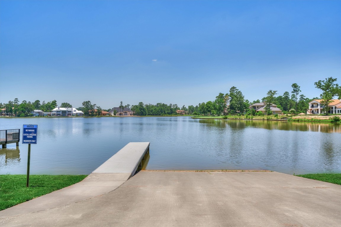 5402 White Birch Run Spring, TX 77386 - Photo 42 of 43 a view of a lake with houses in the back