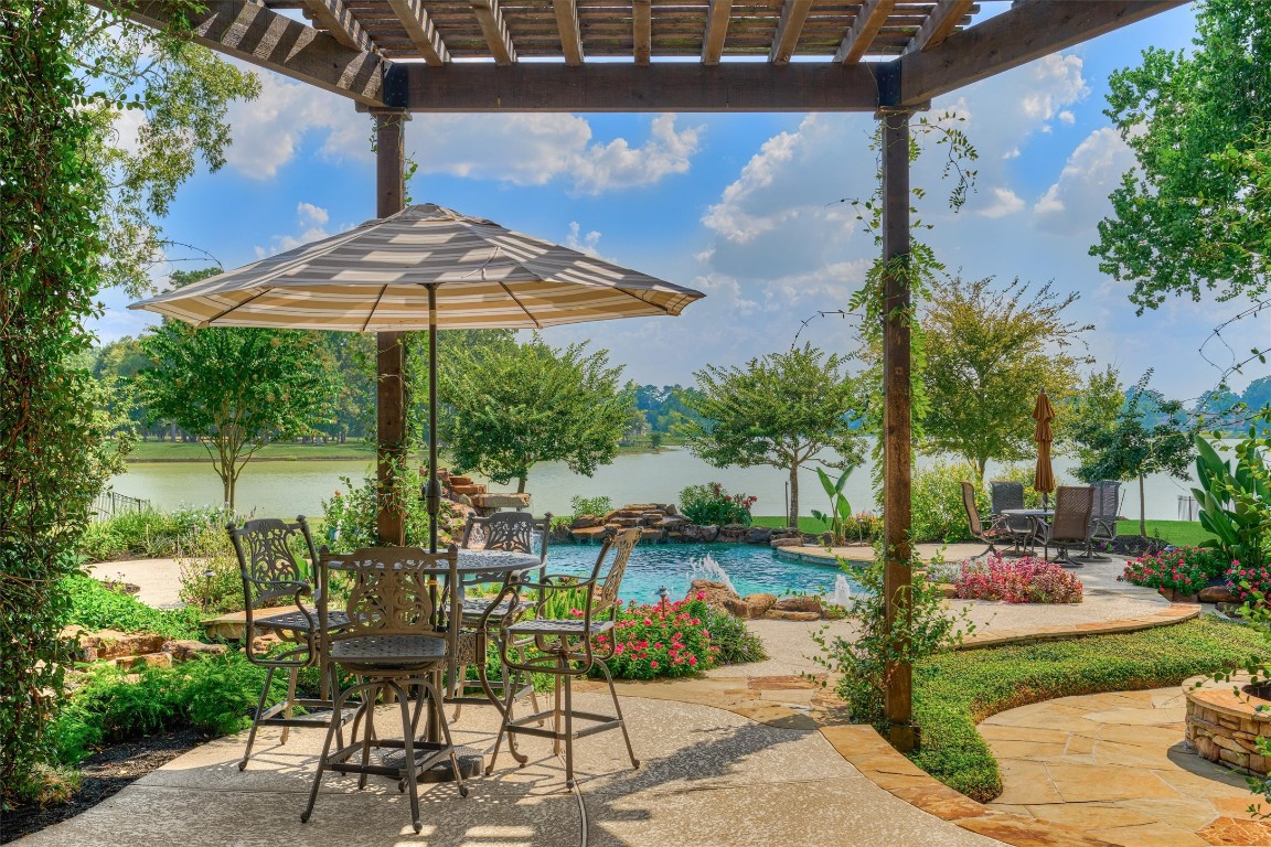 5402 White Birch Run Spring, TX 77386 - Photo 10 of 43 a view of a patio with table and chairs under an umbrella
