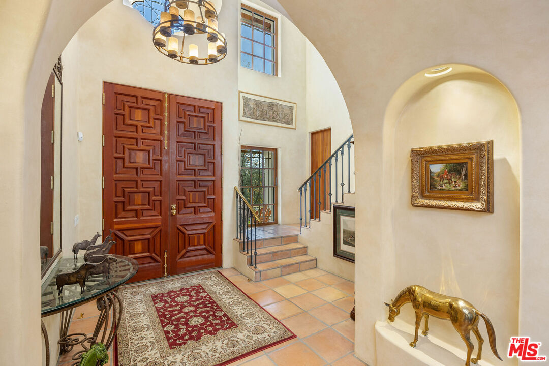 25127 Jim Bridger Road Hidden Hills, CA 91302 - Photo 8 of 50 a view of an entryway with wooden floor