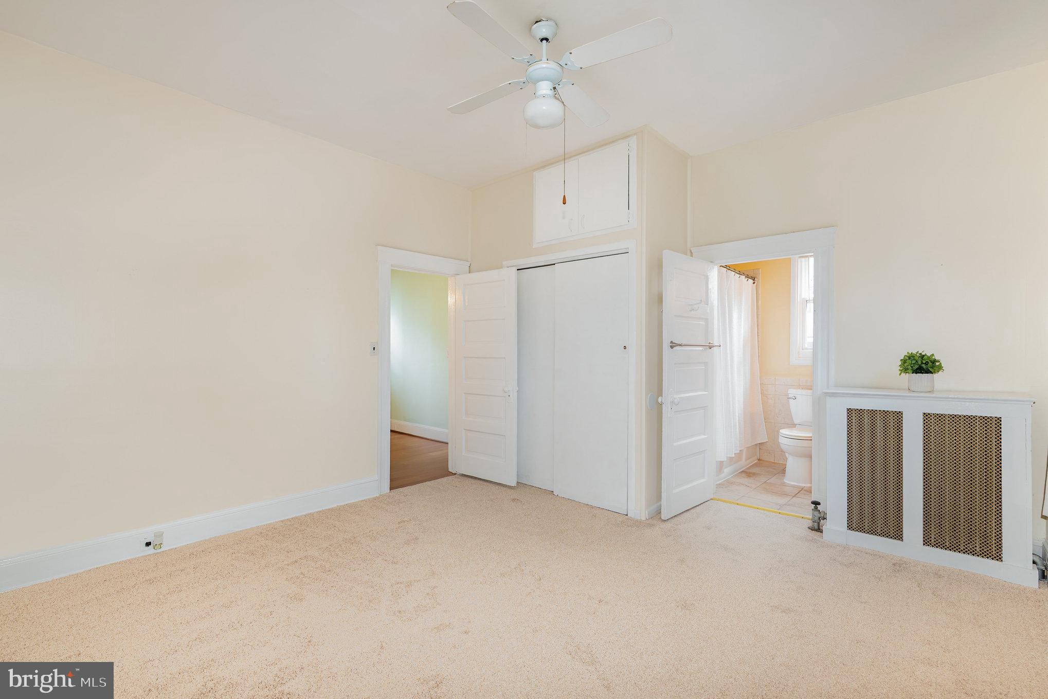 5005 Catalpha Road Baltimore, MD 21214 - Photo 12 of 31 a view of an empty room with closet and a window
