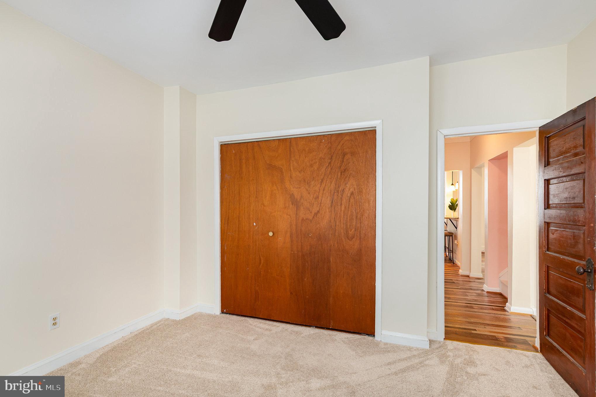 5005 Catalpha Road Baltimore, MD 21214 - Photo 22 of 31 an empty room with closet and windows