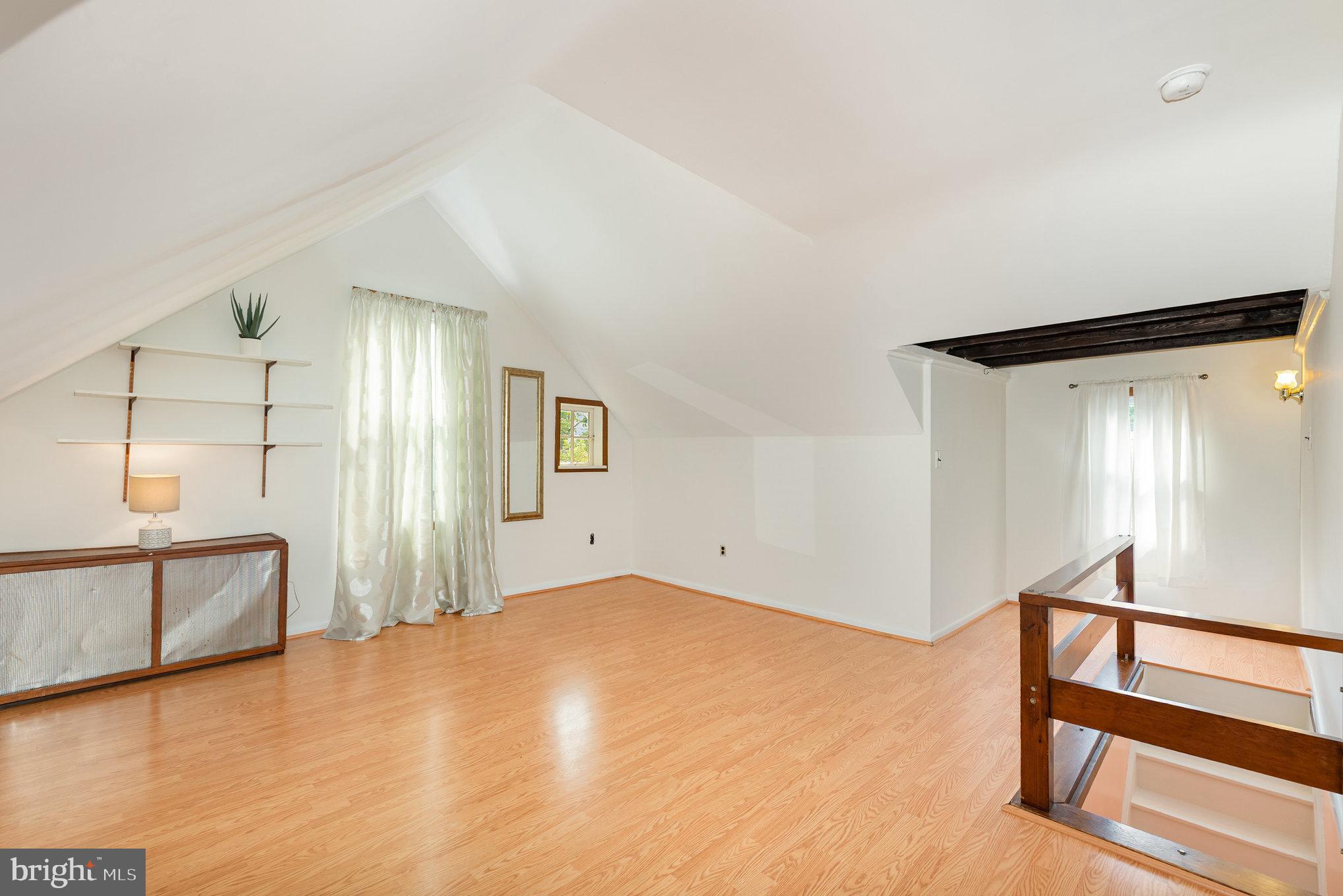 5005 Catalpha Road Baltimore, MD 21214 - Photo 24 of 31 a view of a room with window and hardwood floor