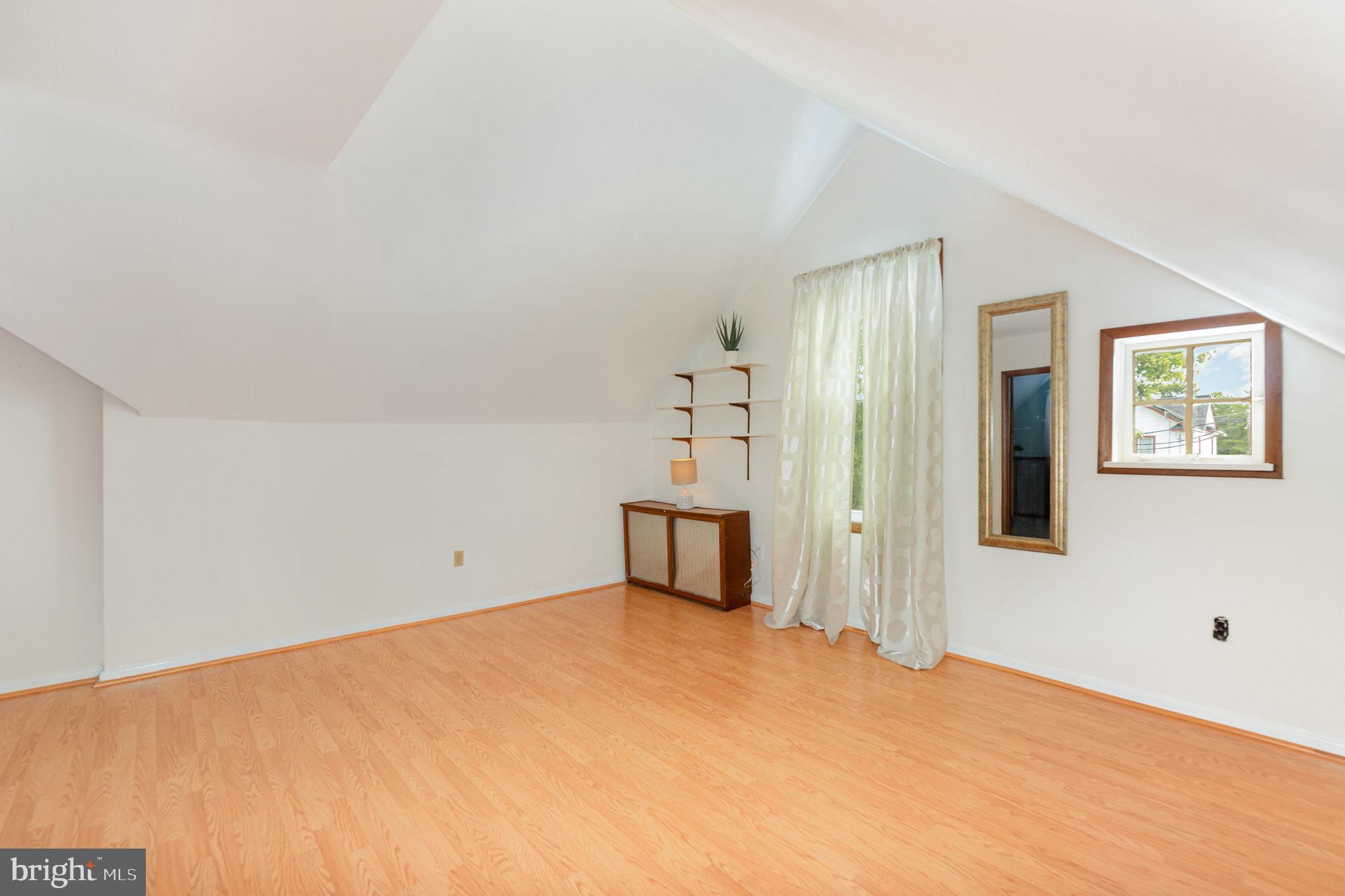 5005 Catalpha Road Baltimore, MD 21214 - Photo 25 of 31 a big room with cabinet and mirror