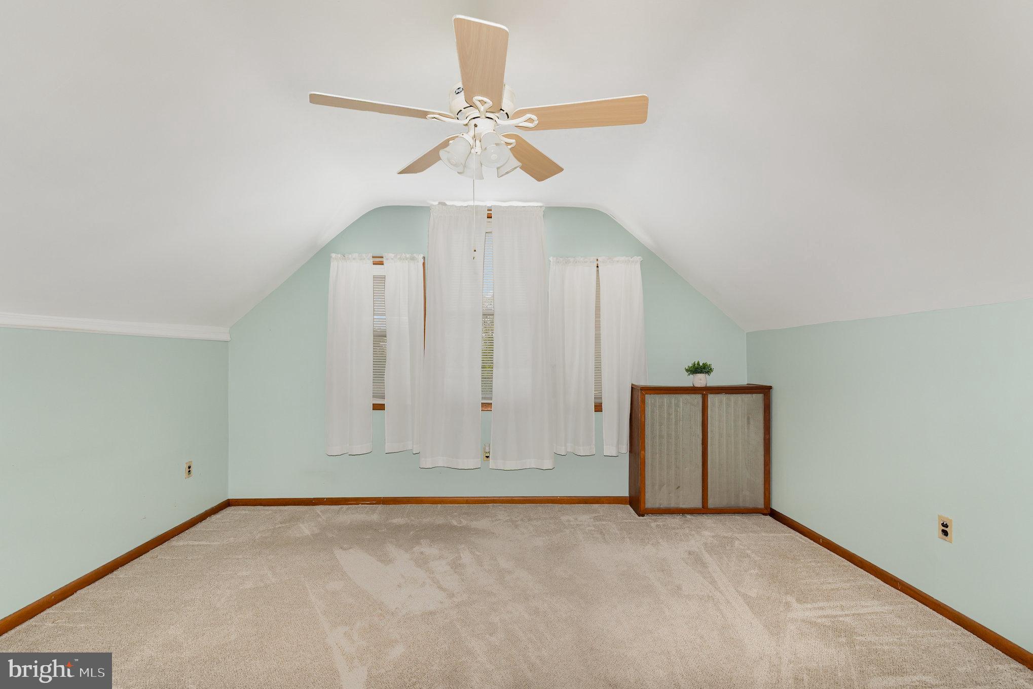 5005 Catalpha Road Baltimore, MD 21214 - Photo 27 of 31 an empty room with closet and a chandelier fan