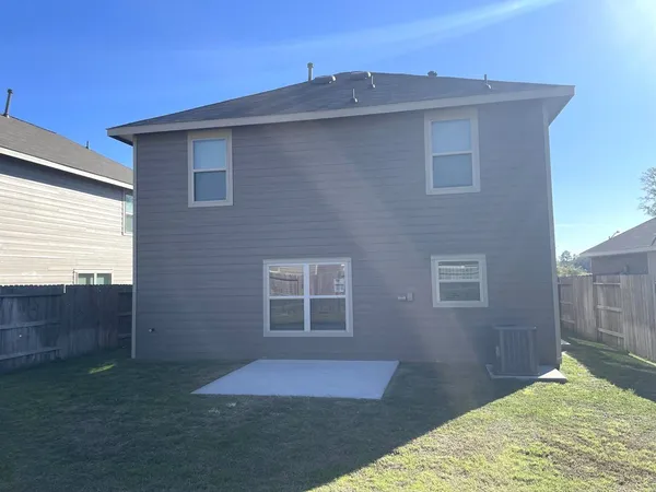 a patio with table and chairs