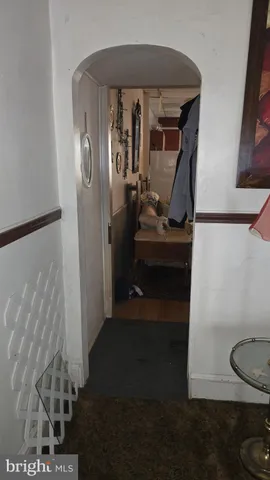 a view of a room with workspace and music instruments