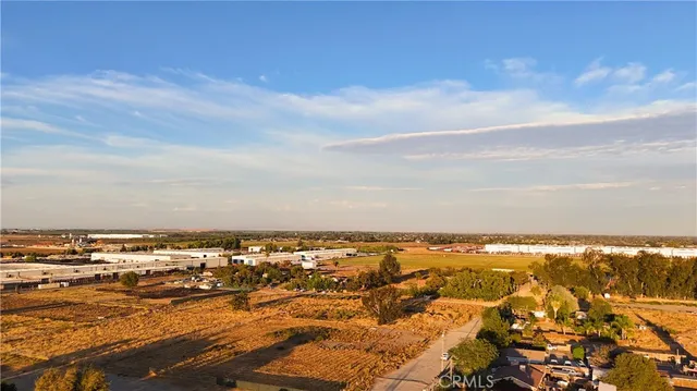 an aerial view of residential building and ocean