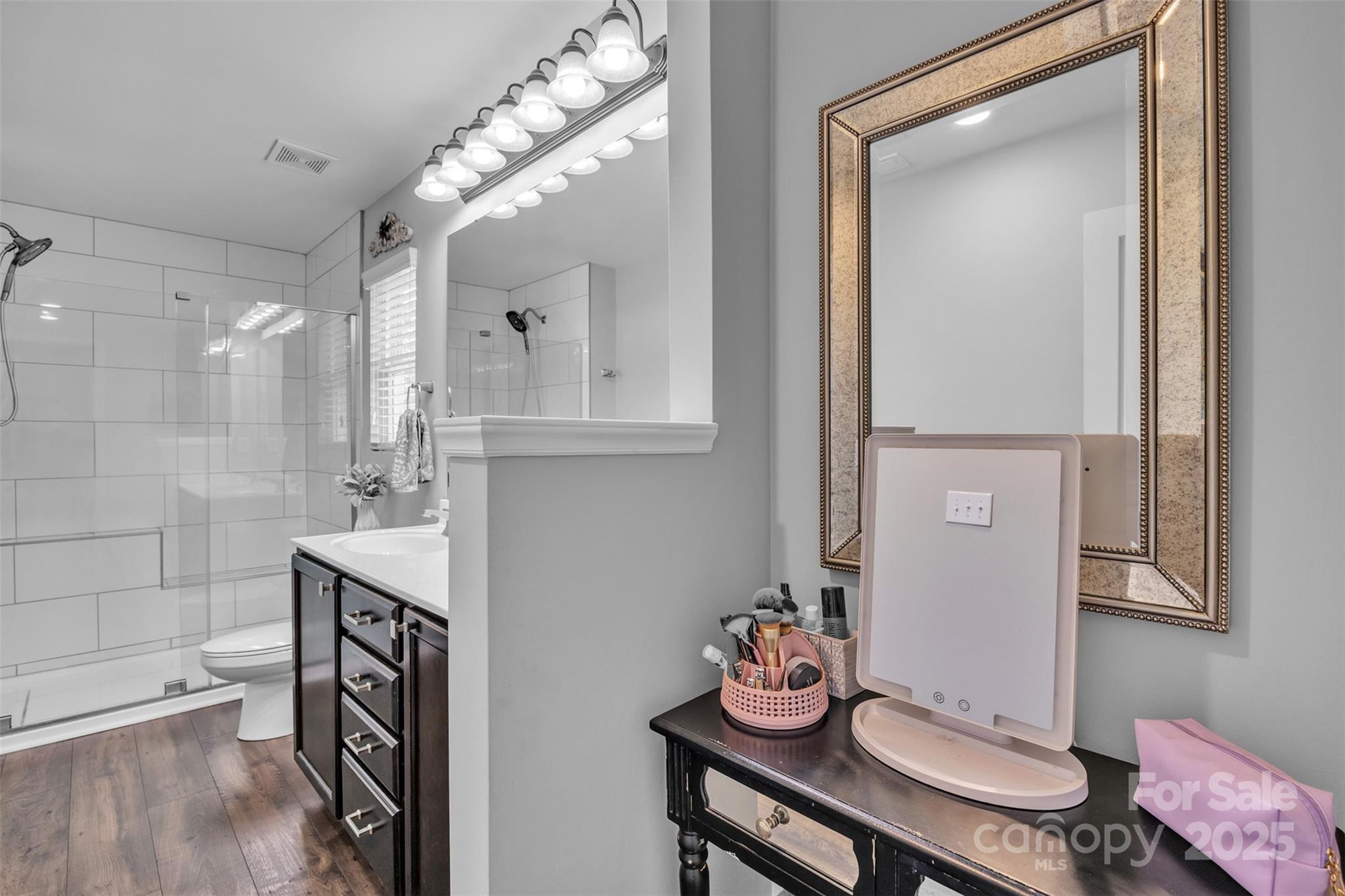 19455 Smith Circle Cornelius, NC 28031 - Photo 19 of 24 a bathroom with a sink mirror and vanity
