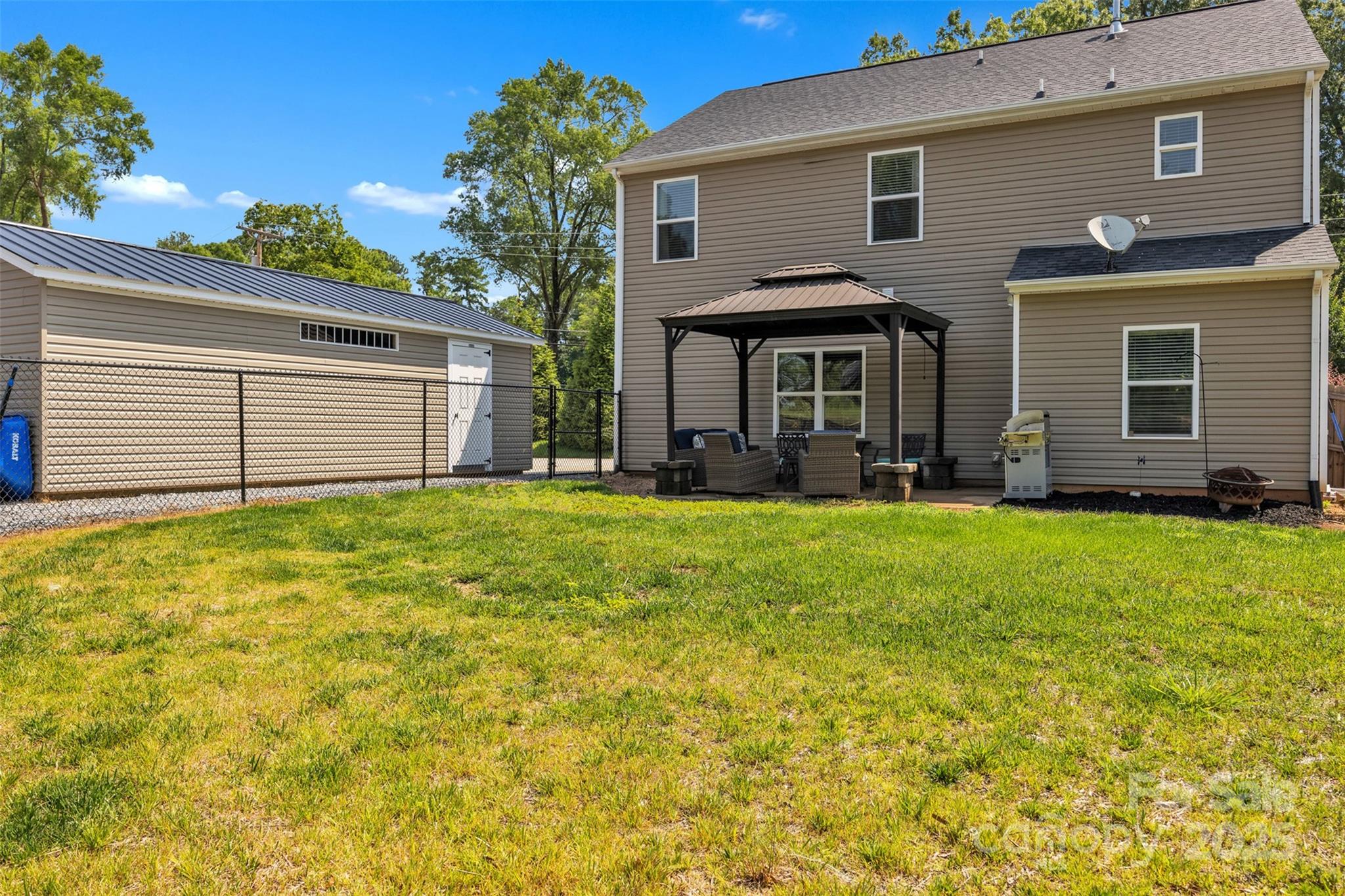 19455 Smith Circle Cornelius, NC 28031 - Photo 23 of 24 a front view of a house with garden
