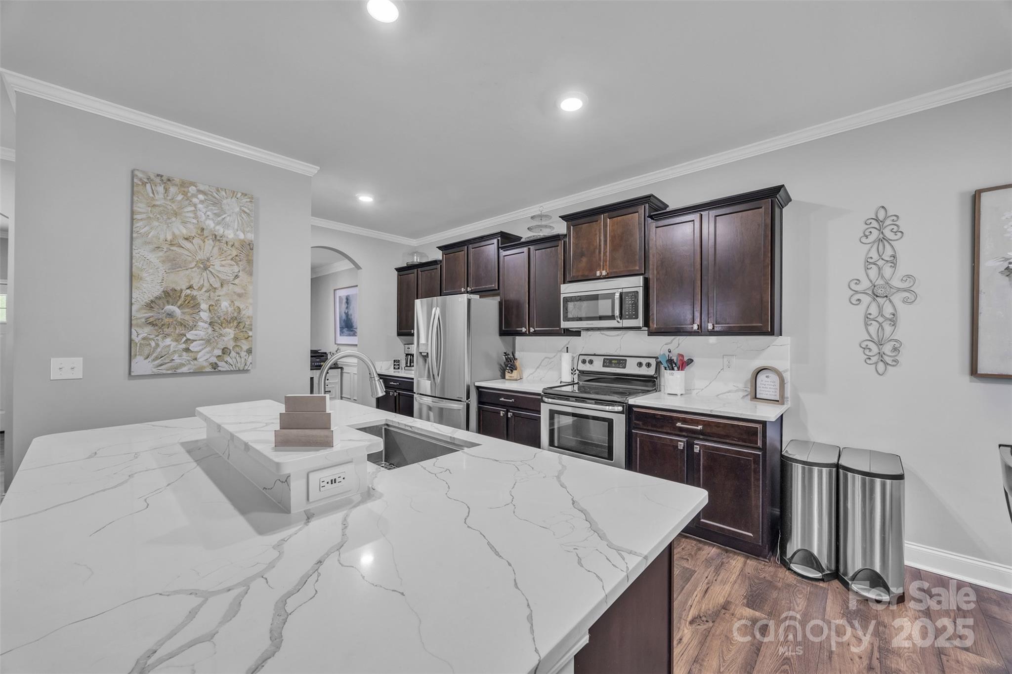 19455 Smith Circle Cornelius, NC 28031 - Photo 6 of 24 a kitchen with stainless steel appliances kitchen island granite countertop a sink stove and refrigerator