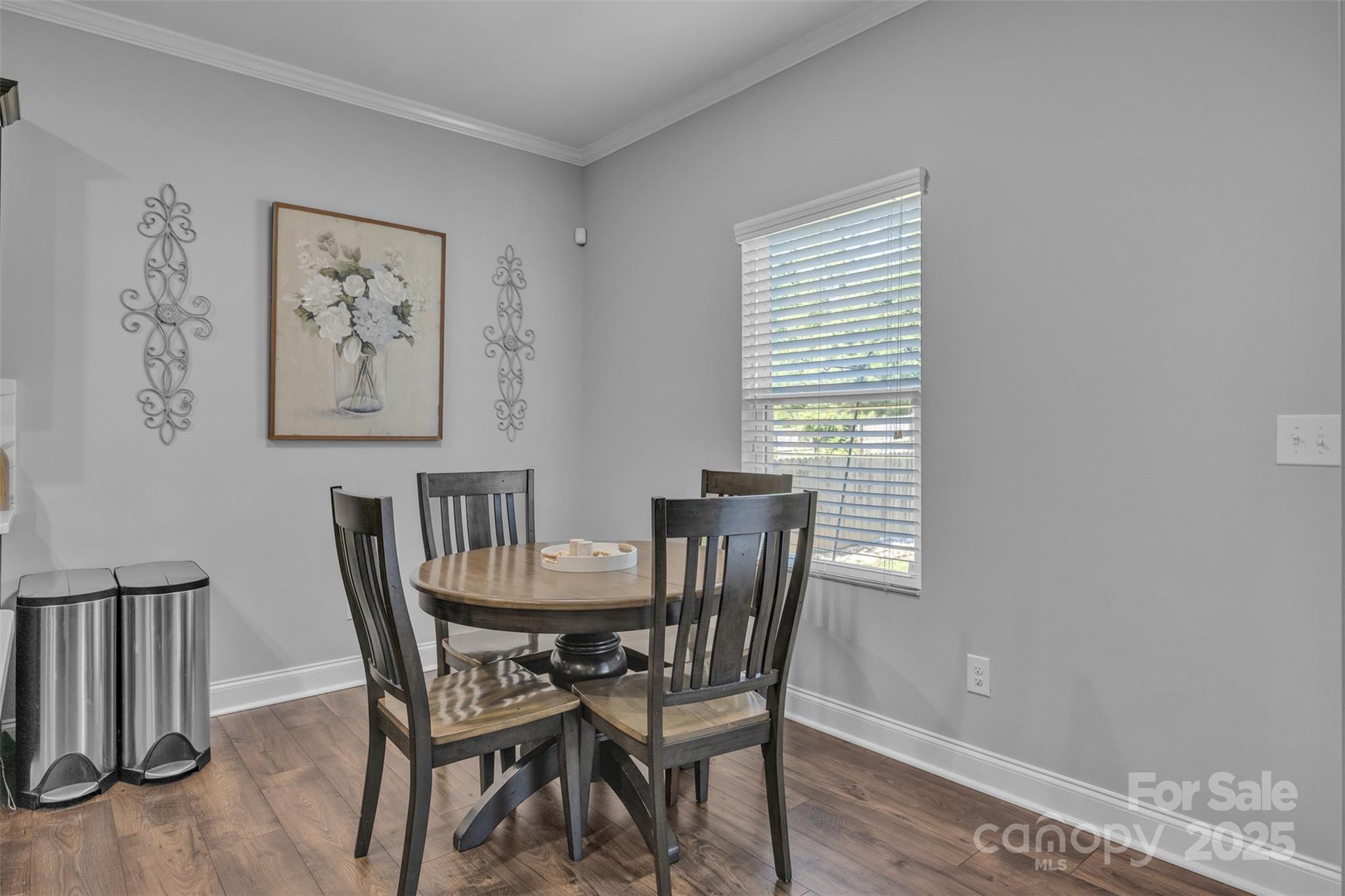 19455 Smith Circle Cornelius, NC 28031 - Photo 9 of 24 a view of a dining room with furniture and wooden floor