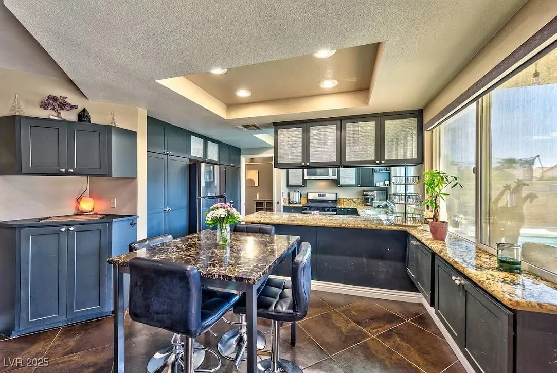 4823 Illustrious Street Las Vegas, NV 89147 - Photo 13 of 34 Kitchen featuring appliances with stainless steel