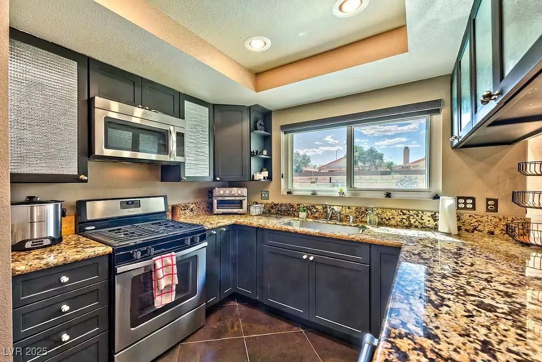4823 Illustrious Street Las Vegas, NV 89147 - Photo 14 of 34 Kitchen with appliances with stainless steel finis