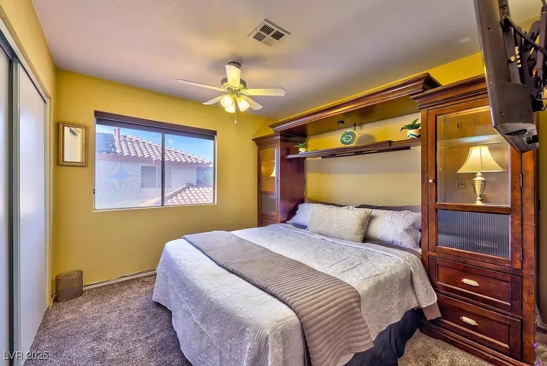 4823 Illustrious Street Las Vegas, NV 89147 - Photo 21 of 34 Carpeted bedroom with a closet and a ceiling fan
