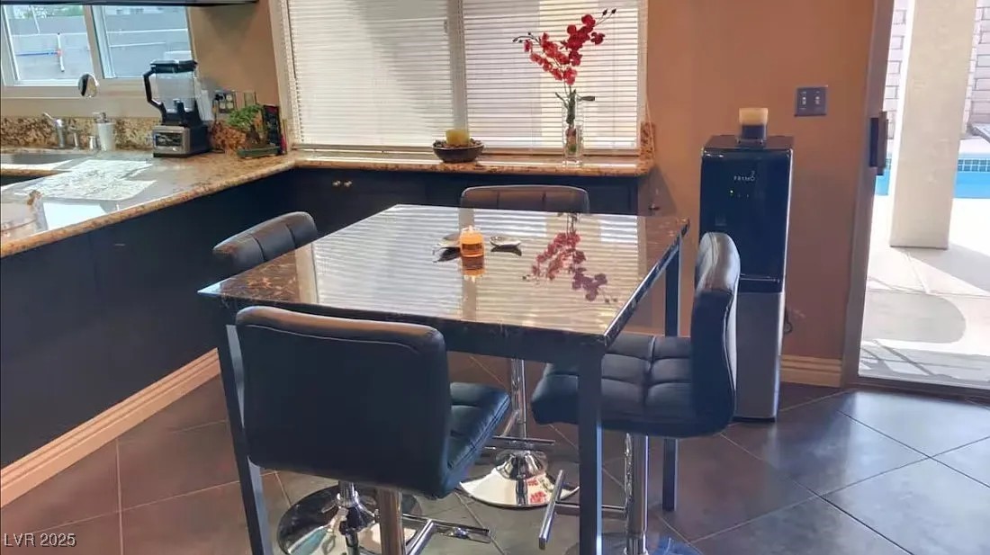 4823 Illustrious Street Las Vegas, NV 89147 - Photo 24 of 34 Dining room featuring tile patterned floors and he