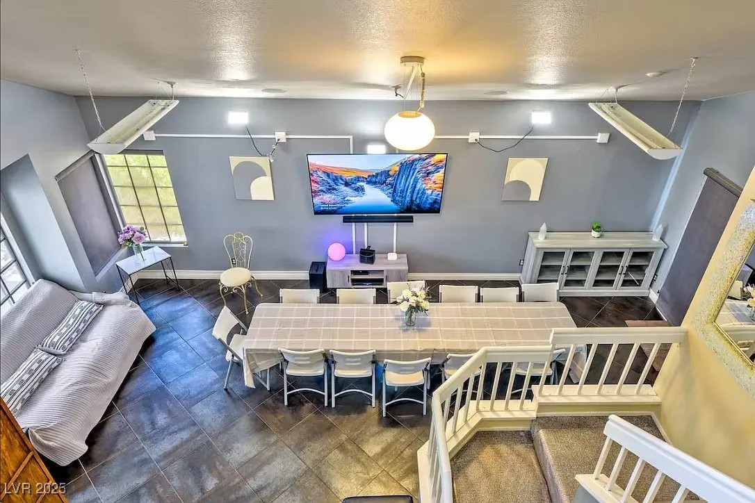 4823 Illustrious Street Las Vegas, NV 89147 - Photo 3 of 34 Dining room with baseboards and a textured ceiling