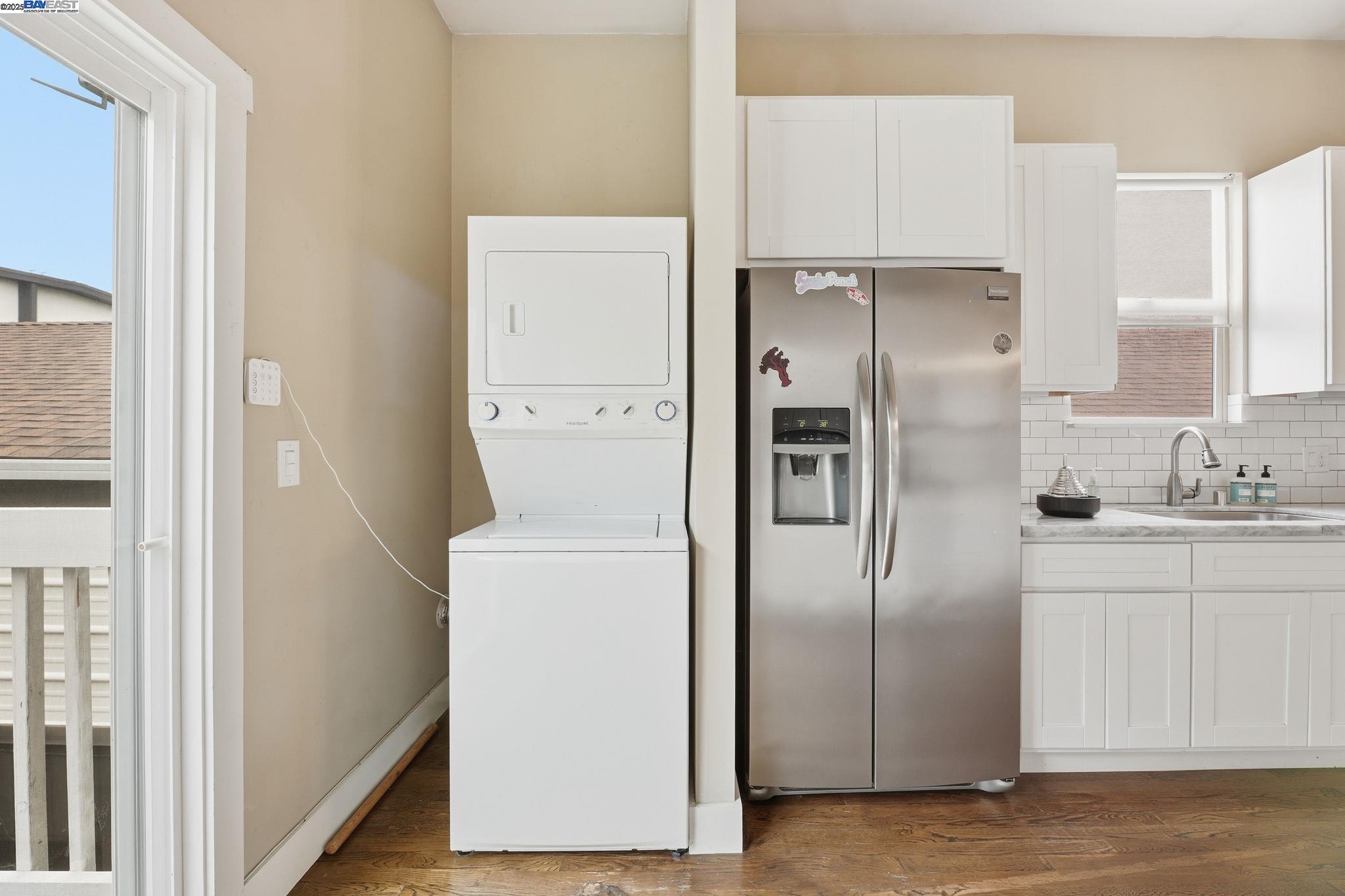 2417 Linden Street Oakland, CA 94607 - Photo 18 of 41 a kitchen with refrigerator a sink and cabinets
