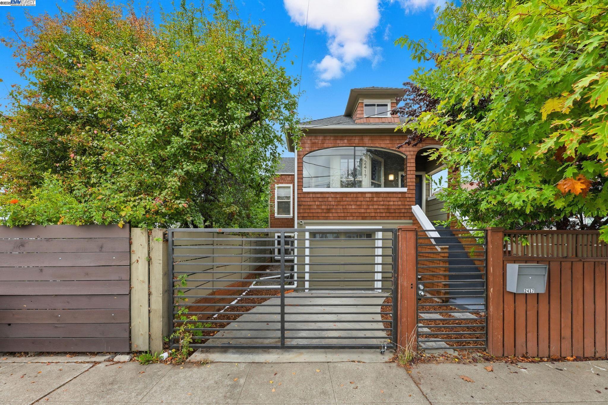 2417 Linden Street Oakland, CA 94607 - Photo 2 of 41 a front view of a house with a tree