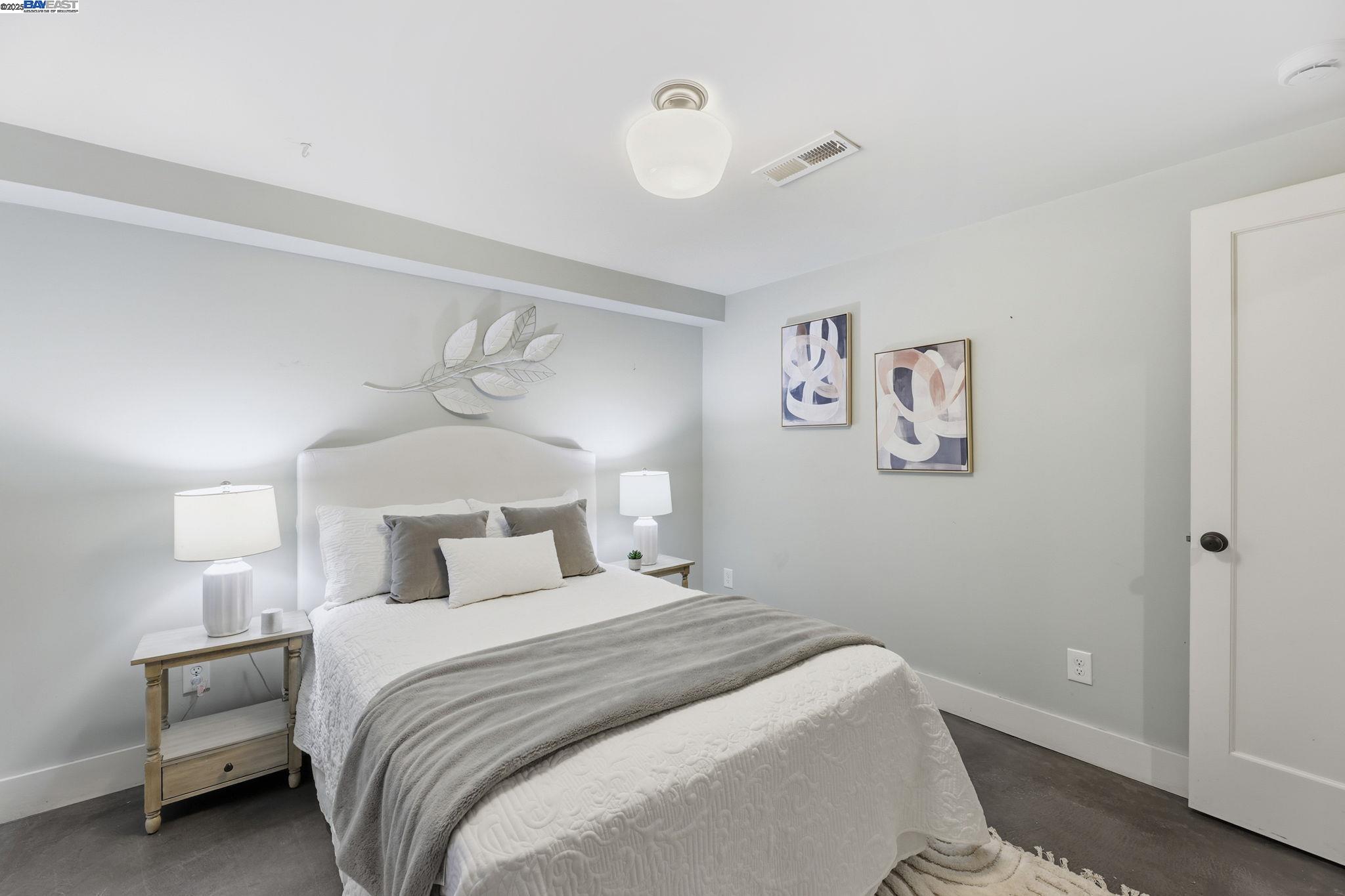 2417 Linden Street Oakland, CA 94607 - Photo 28 of 41 a bedroom with a large bed and a window