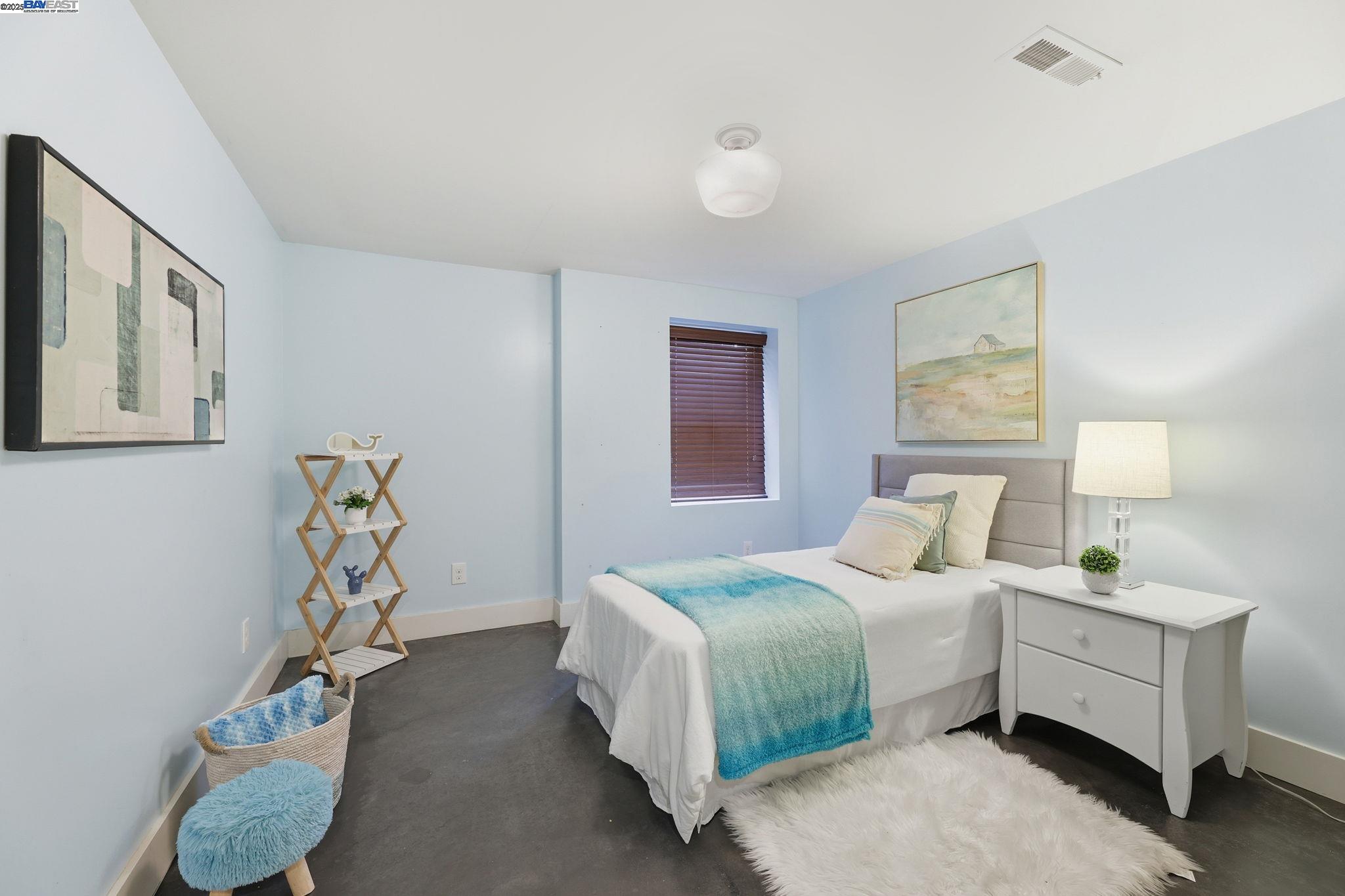 2417 Linden Street Oakland, CA 94607 - Photo 29 of 41 a bedroom with bed and a window