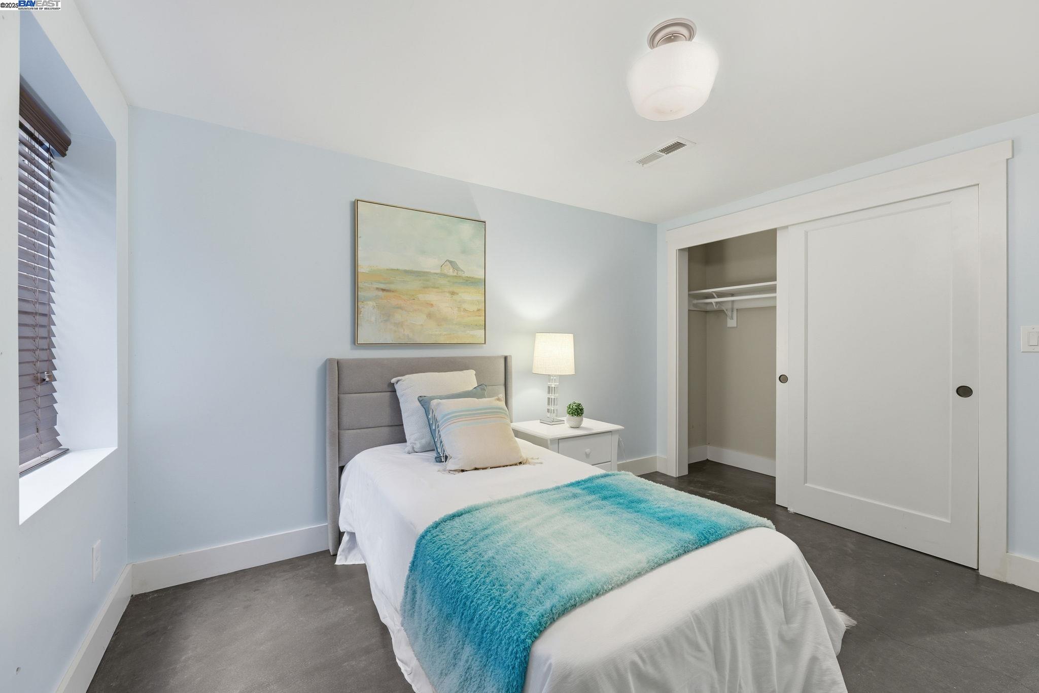 2417 Linden Street Oakland, CA 94607 - Photo 30 of 41 a bedroom with a bed and a window