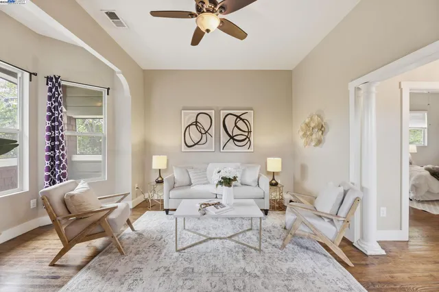 a living room with furniture and a window