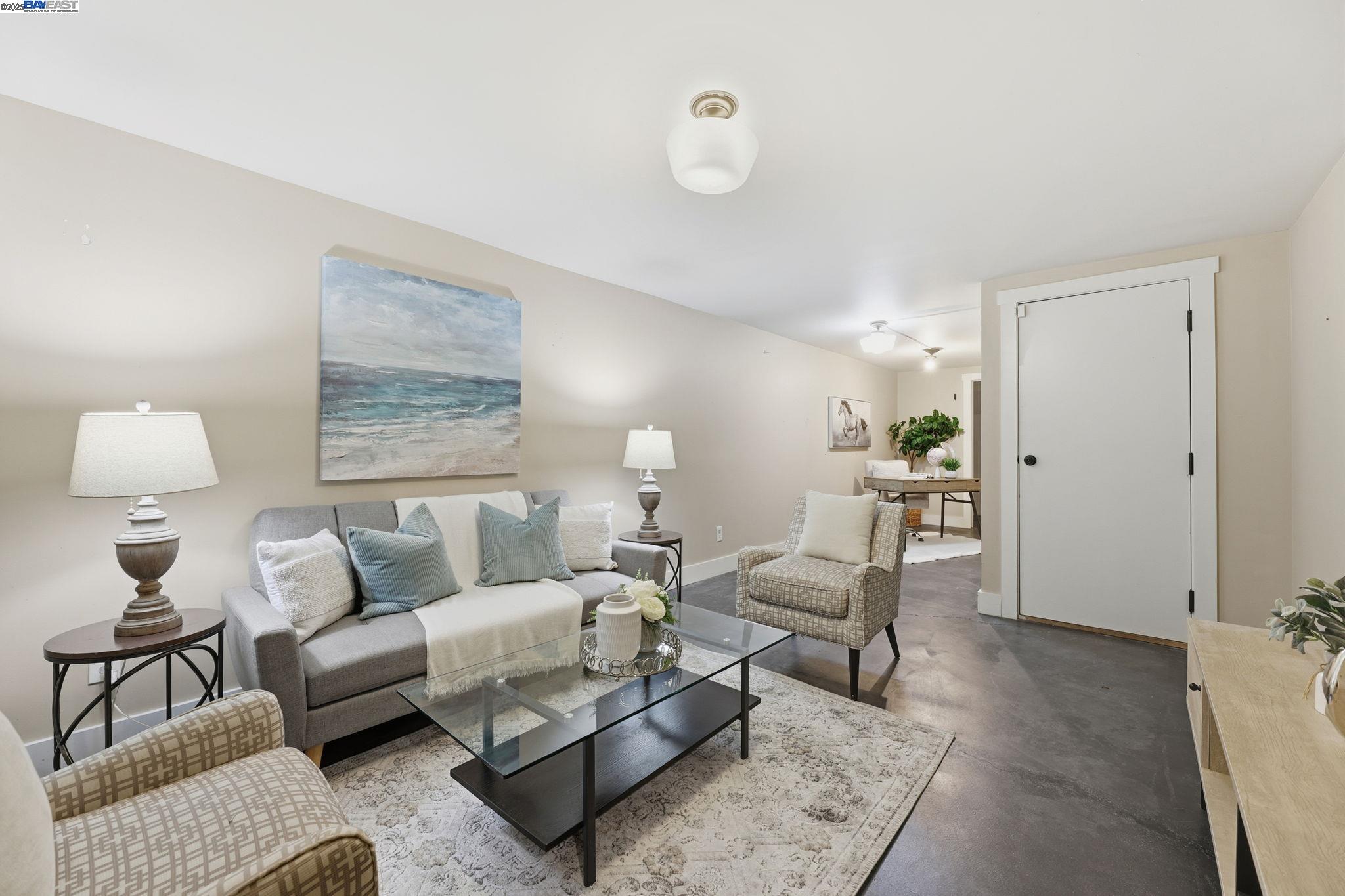 2417 Linden Street Oakland, CA 94607 - Photo 9 of 41 a living room with furniture and a lamp