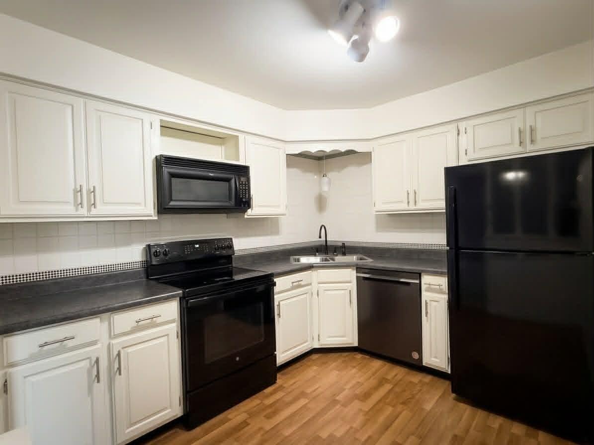 2003 West 45th Street, Unit 207 Highland, IN 46322 - Photo 4 of 13 a kitchen with a sink stove and refrigerator