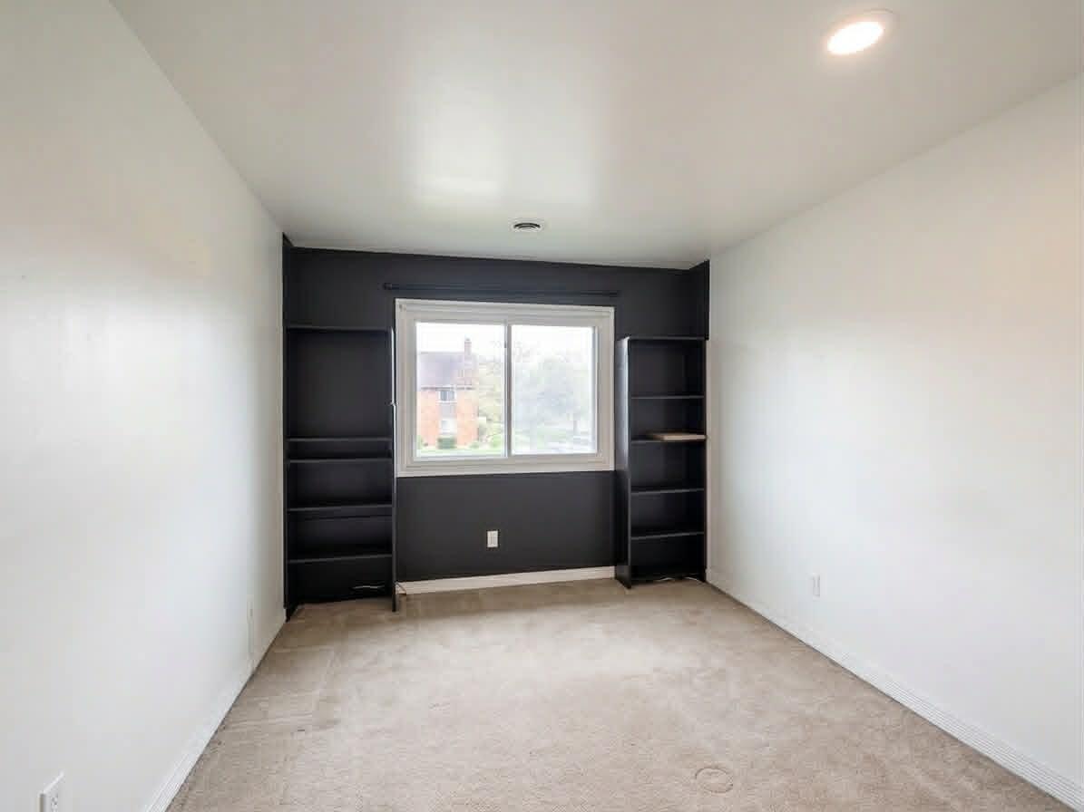 2003 West 45th Street, Unit 207 Highland, IN 46322 - Photo 5 of 13 an empty room with a window and a cabinet