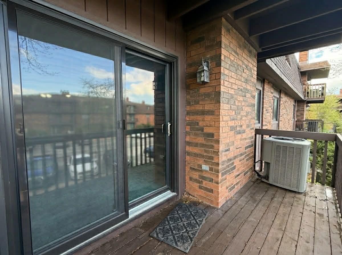 2003 West 45th Street, Unit 207 Highland, IN 46322 - Photo 9 of 13 a view of a glass door with a glass door