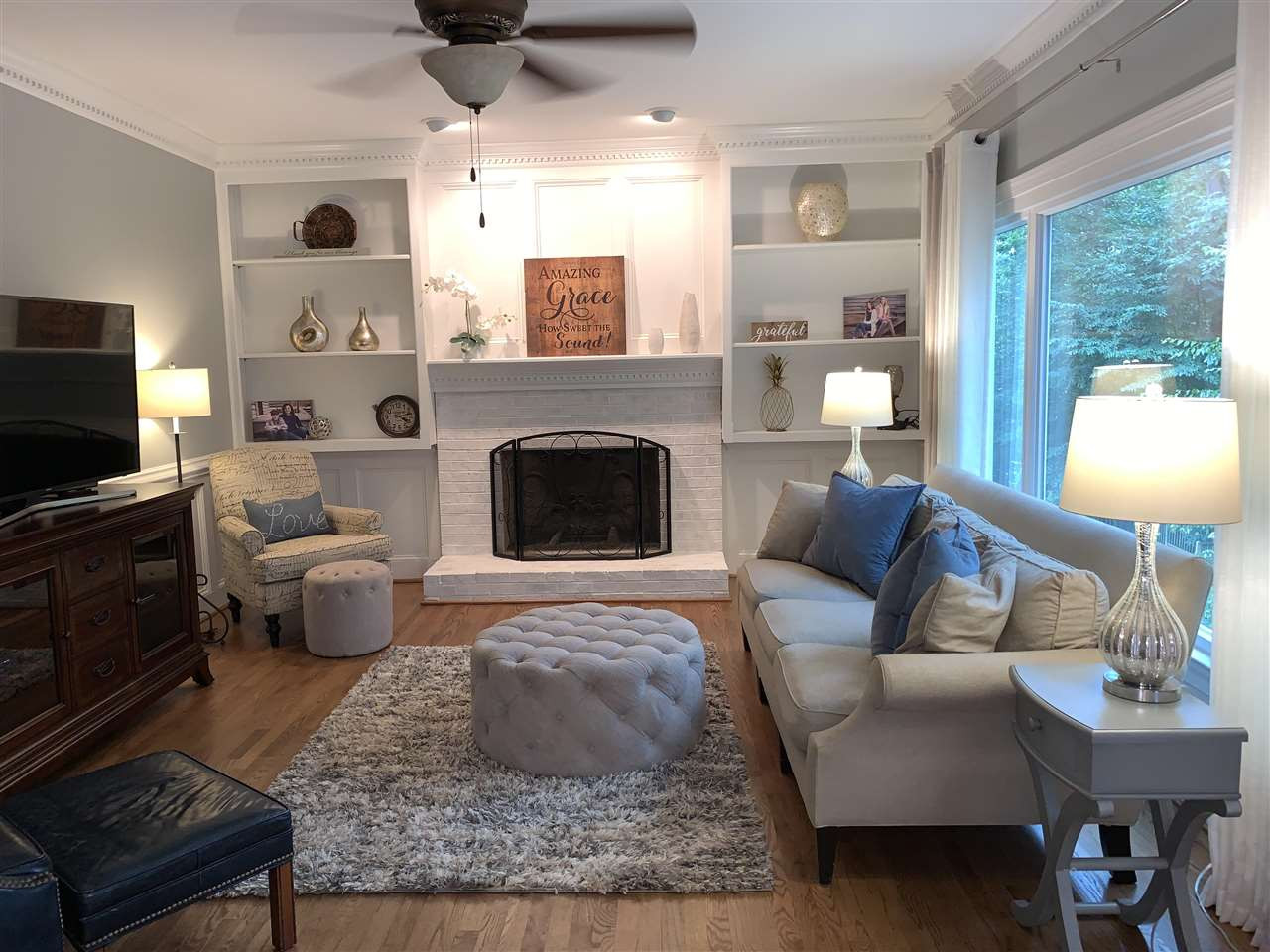 7907 Sandy Bottom Way Raleigh, NC 27613 - Photo 7 of 20 Gas log fireplace & built-ins. Notice the huge picture window! Family Room