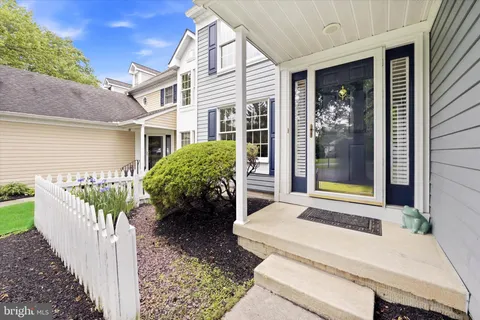 a front view of a house with a porch