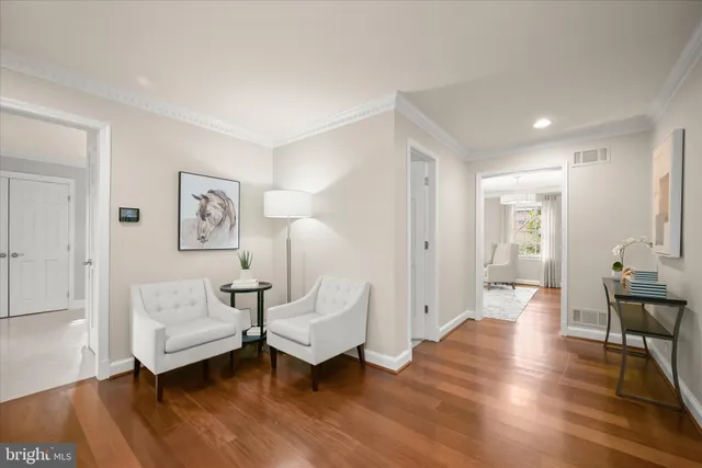 a view of a balcony with wooden floor and fence