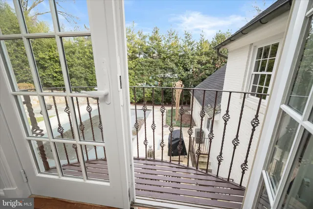 a en suite bathroom with a granite countertop tub and a sink