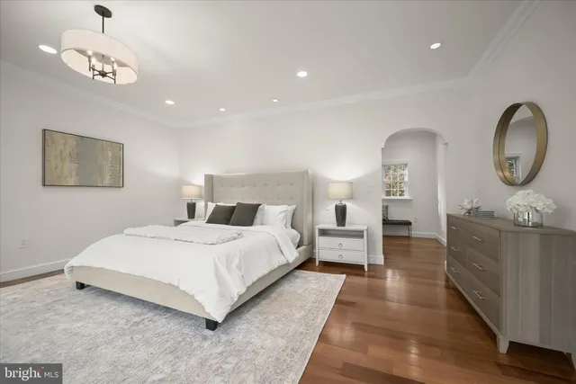 a en suite bathroom with a granite countertop sink and a mirror