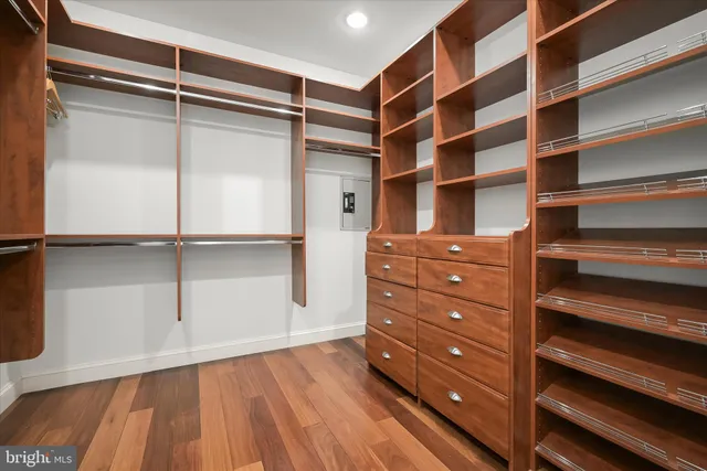 a bathroom with a granite countertop toilet sink and mirror