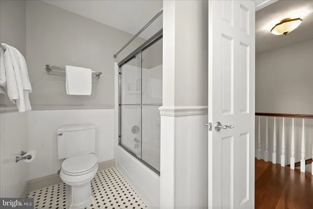 a view of a big room with wooden floor and a fireplace