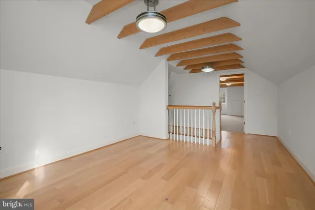 a view of white house with a yard and sitting area