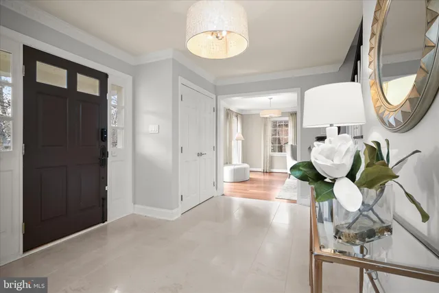 a view of a dining room with furniture a fireplace and wooden floor