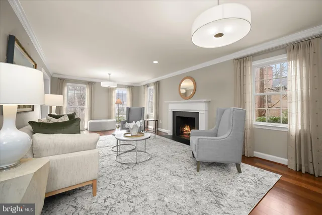 a dining room with furniture window and wooden floor