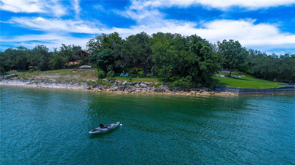 16821 South Ridge Lane Austin, TX 78734 - Photo 1 of 1 a lake view with a yard