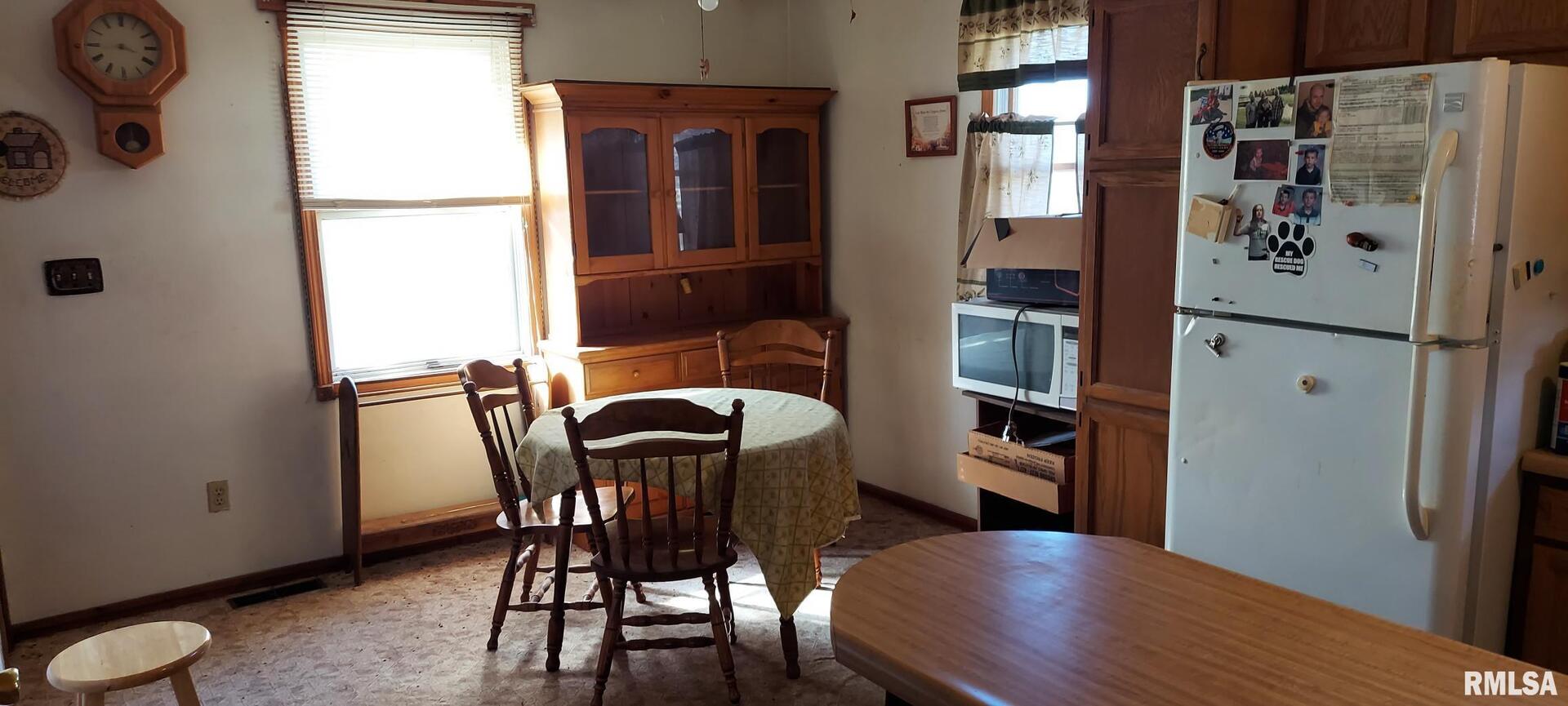 862 270th Street Viola, IL 61486 - Photo 10 of 17 a view of a dining room with furniture and wooden floor