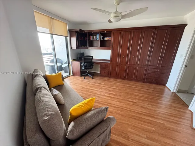 a workspace with furniture and window