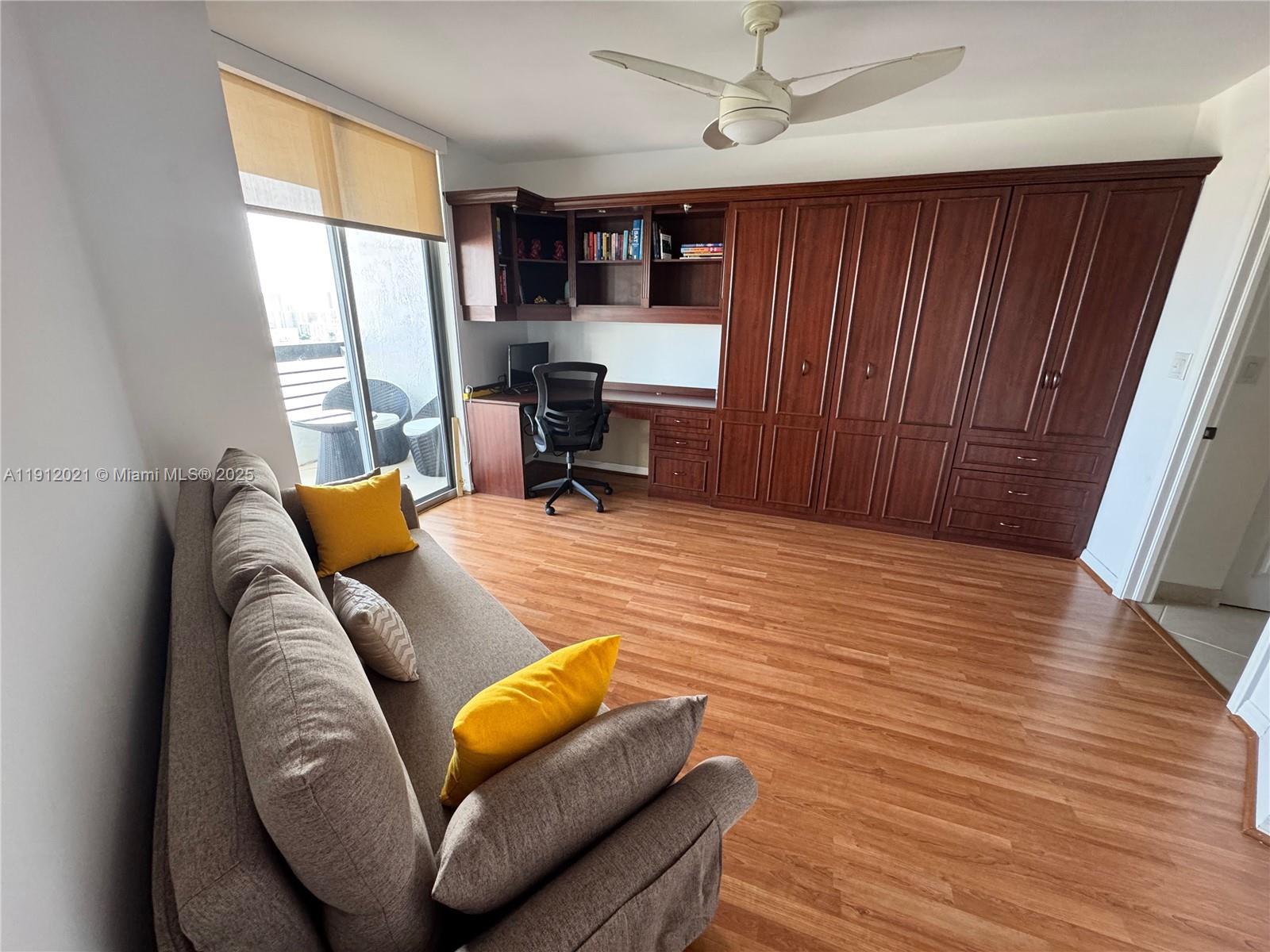 3530 Mystic Pointe Drive, Unit 3111 Aventura, FL 33180 - Photo 18 of 22 a workspace with furniture and window