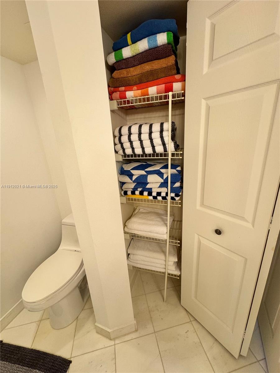 3530 Mystic Pointe Drive, Unit 3111 Aventura, FL 33180 - Photo 22 of 22 a bathroom with a toilet and a shower