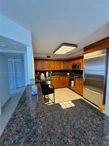 a view of a room with furniture wooden floor and window