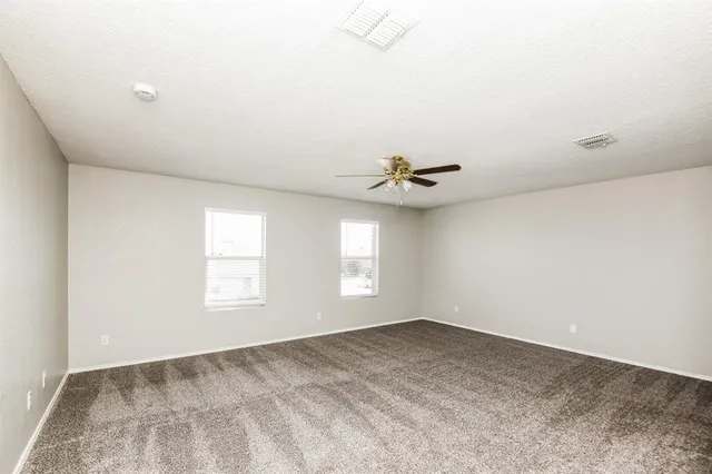 a view of empty room with windows