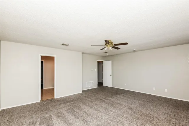 a view of a big room with carpet