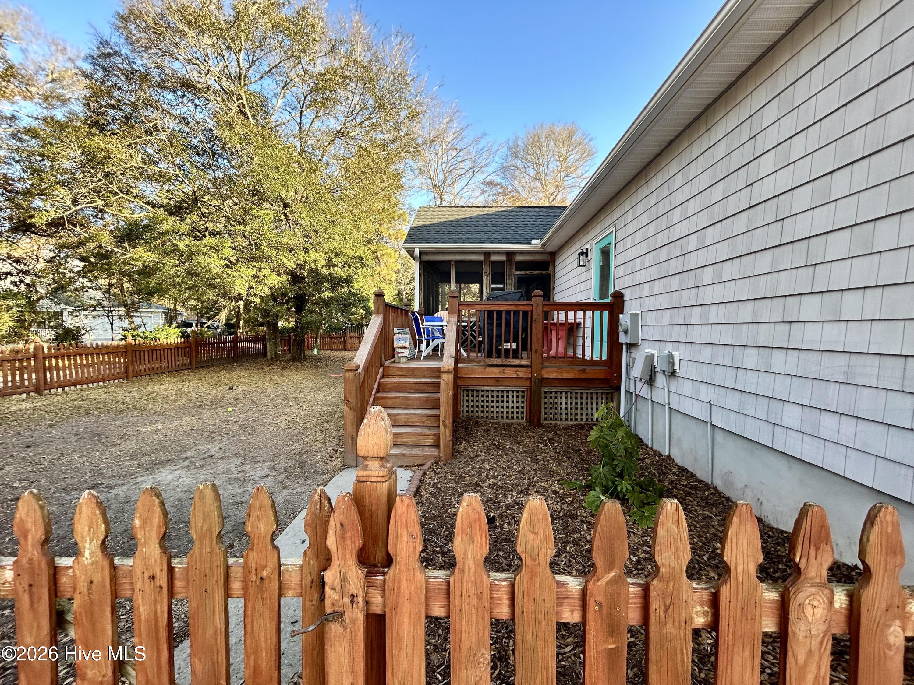 208 Shoreline Drive Cedar Point, NC 28584 - Photo 5 of 12 Back deck and screened in porch